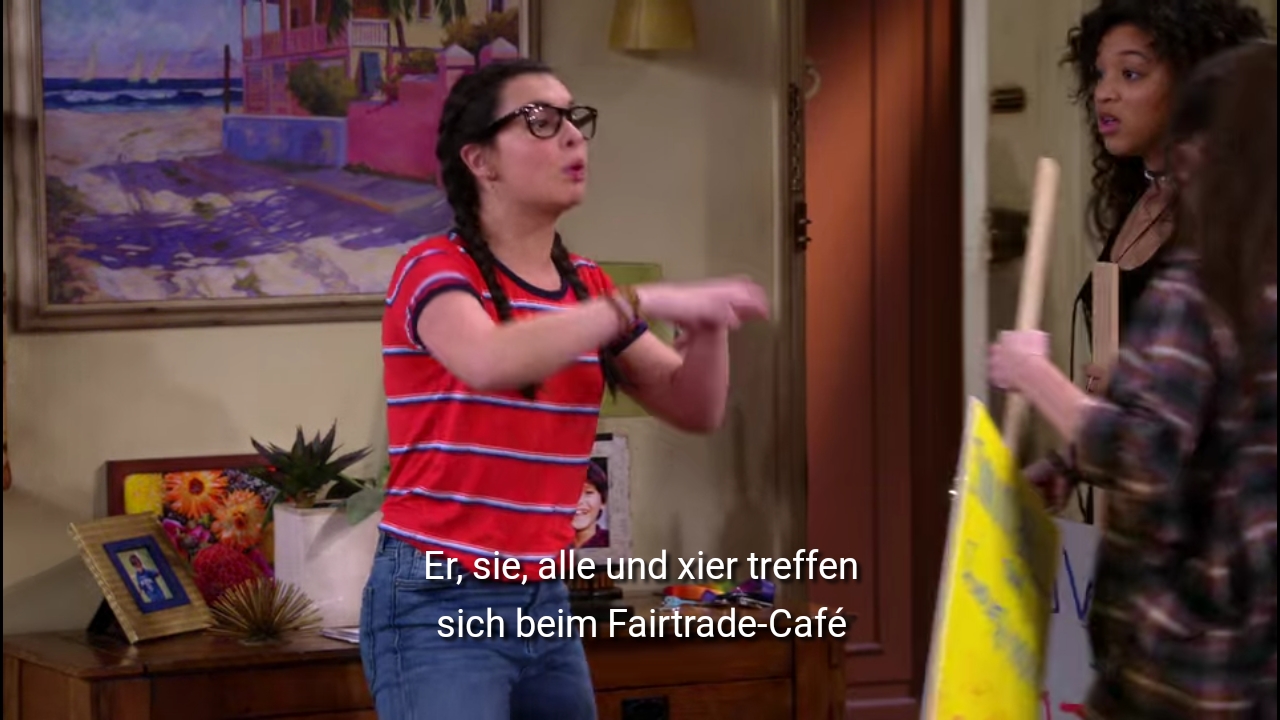 Elena sagt weiter: Er, sie, alle und xier treffen sich beim Fairtrade Café.